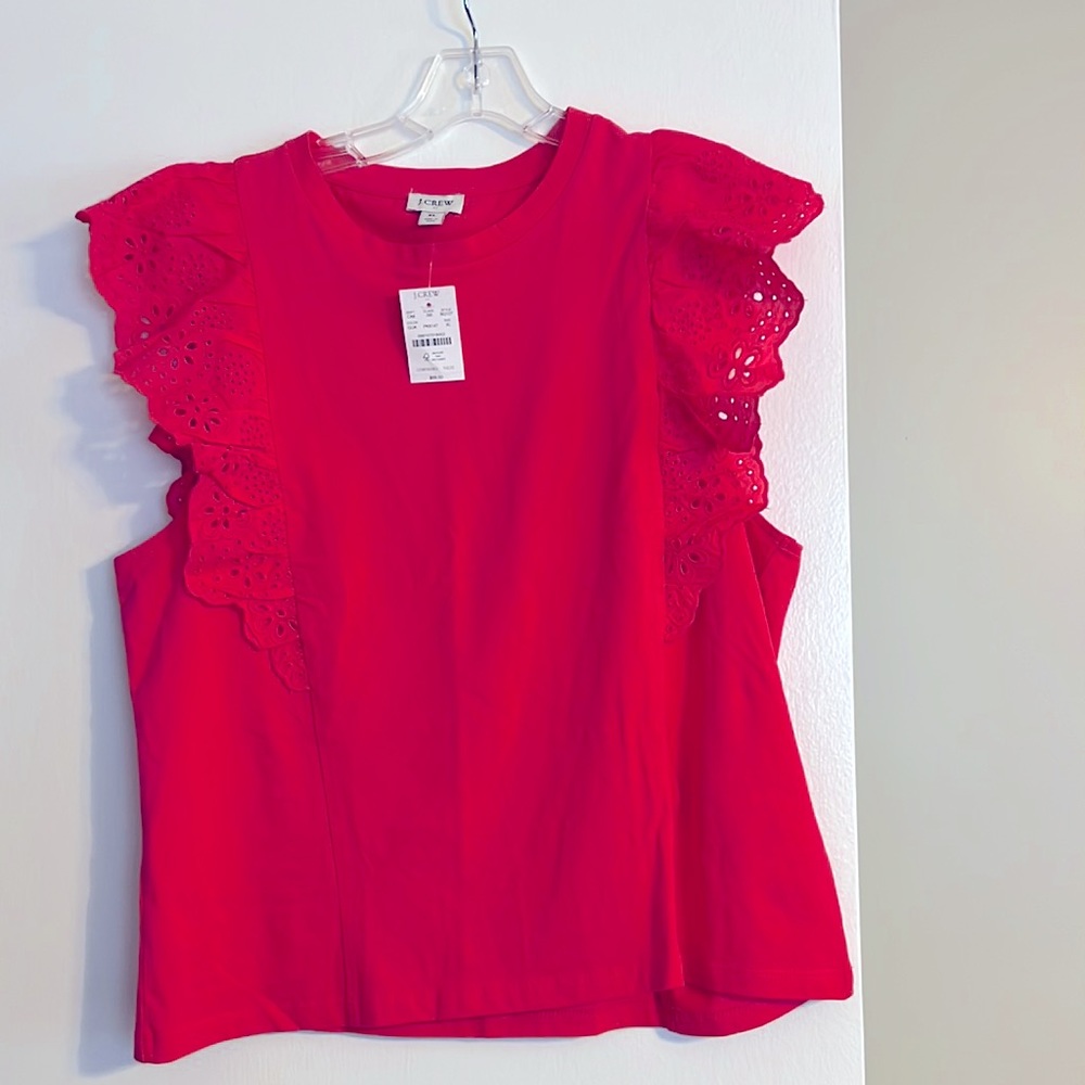 J Crew new with tag top.  The color is  pink but is more like a salmon color